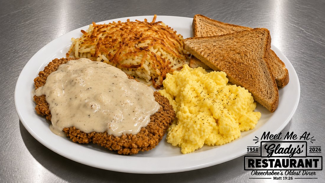 Country fried steak with eggs, hash browns, and toast